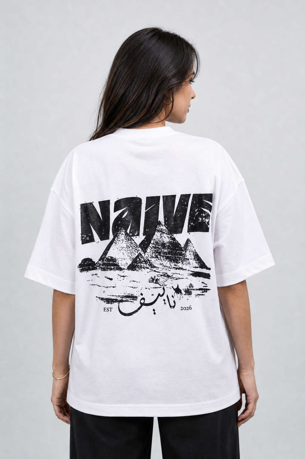 NAIVE Pyramids White Tee - white oversized t-shirt with NAIVE x Pyramids of Giza print - back view on female model